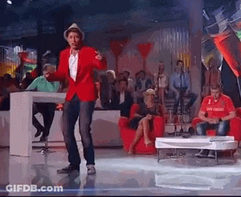 Man In Red Jacket Dancing On Stage GIF