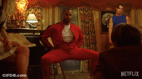 Man In Red Jacket Dancing With Netflix Logo GIF