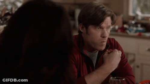 Man In Red Jacket Eating Pizza GIF