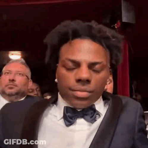 Man In Red Jacket Eating Popcorn In Theater GIF