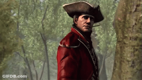 Man In Red Jacket Hat Smoking Cigarette In Woods GIF