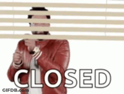 Man In Red Jacket Hiding Behind Blinds Closed GIF