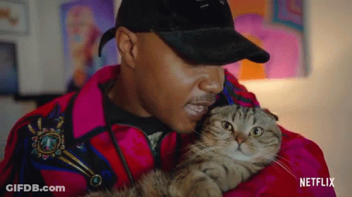 Man In Red Jacket Holding Cat GIF