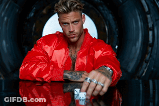 Man In Red Jacket Holding Dice GIF