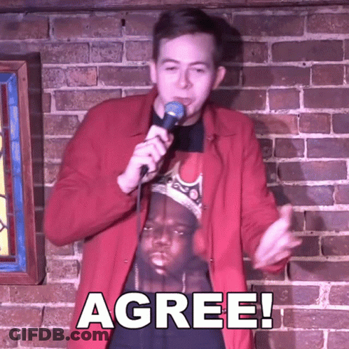 Man In Red Jacket Holding Microphone GIF