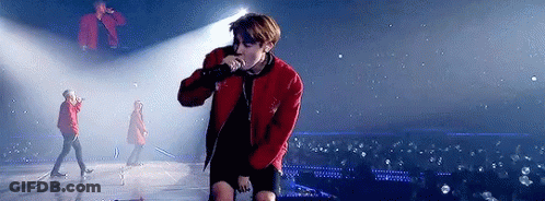 Man In Red Jacket Holding Microphone GIF