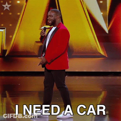 Man In Red Jacket Holding Microphone Says I Need A Car GIF