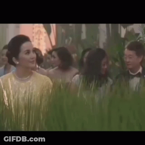 Man In Red Jacket Holding Paper Asking Is This The Video GIF