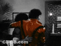 Man In Red Jacket Hugging Woman GIF
