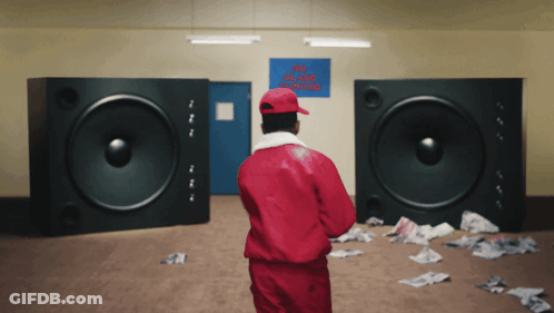 Man In Red Jacket In Front Of No Smoking Sign GIF