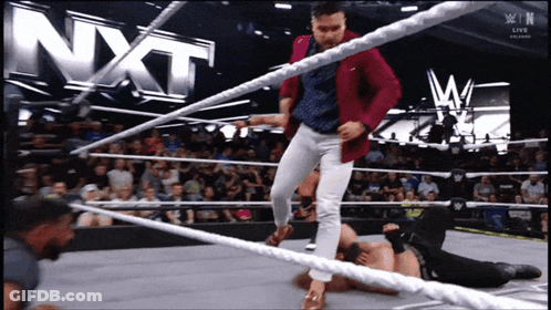 Man In Red Jacket Kicking Opponent GIF