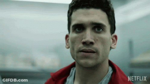 Man In Red Jacket Looking At Camera With Netflix Logo GIF