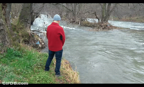 Man In Red Jacket Looking At River GIF