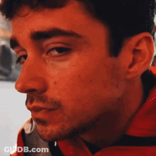 Man In Red Jacket Looking GIF
