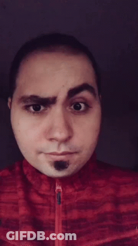 Man In Red Jacket Making Face GIF