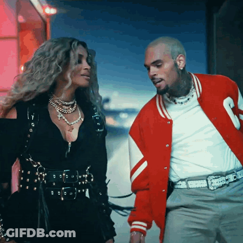 Man In Red Jacket Next To Woman GIF