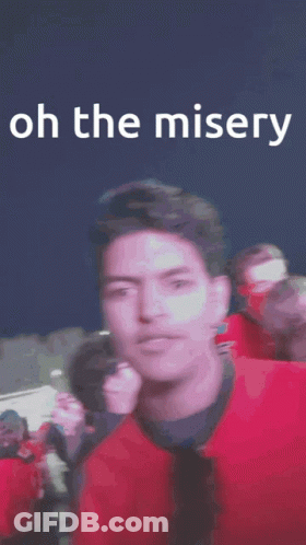 Man In Red Jacket Number 5 In Crowd GIF
