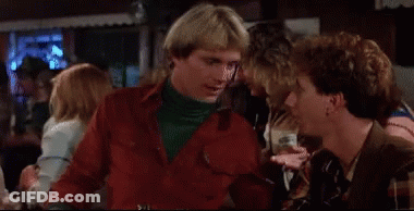 Man In Red Jacket Pointing At Smiling Man GIF