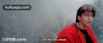 Man In Red Jacket Says She Flirts Like A Flower GIF