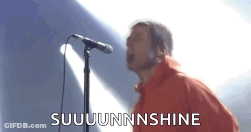 Man In Red Jacket Singing Into Microphone GIF
