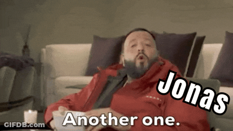 Man In Red Jacket Sitting On Couch Jonas Another One GIF