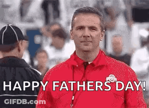 Man In Red Jacket Standing In Front Of Crowd GIF