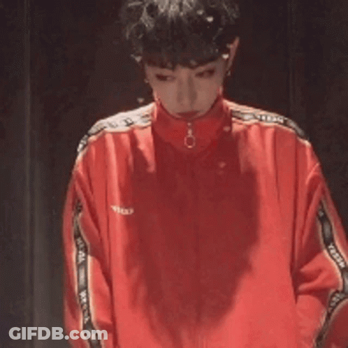 Man In Red Jacket Standing Next To Another Man GIF