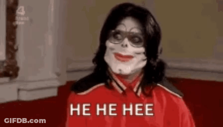 Man In Red Jacket Surrounded By Zombies GIF