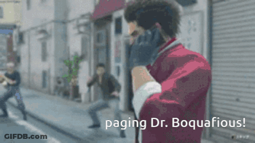 Man In Red Jacket Talking On Cell Phone Paging Dr. Boquacious GIF