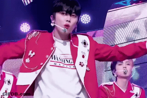 Man In Red Jacket Wearing Washington Magazine Shirt GIF