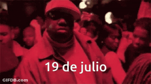 Man In Red Jacket With 19 De Julio GIF