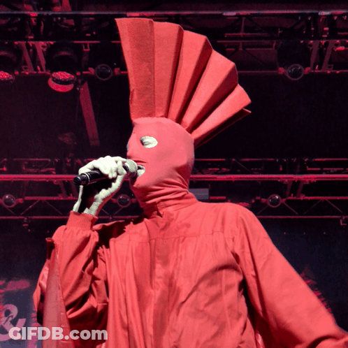 Man In Red Jacket With Arrows Smiling GIF