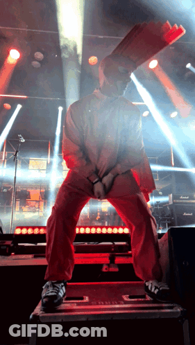 Man In Red Jacket With Bag On Head GIF