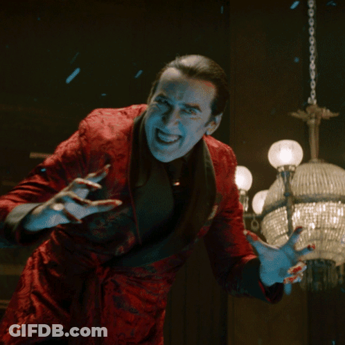 Man In Red Jacket With Blood On Hands GIF