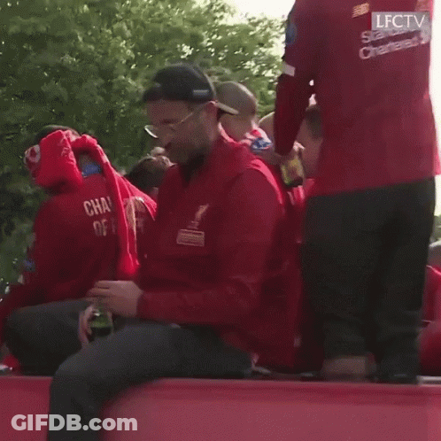 Man In Red Jacket With Champions GIF
