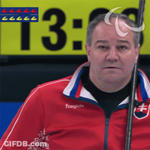 Man In Red Jacket With Foxglide Holding Stick GIF