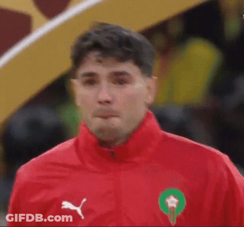 Man In Red Jacket With Green Circle GIF