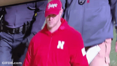 Man In Red Jacket With Letter N GIF