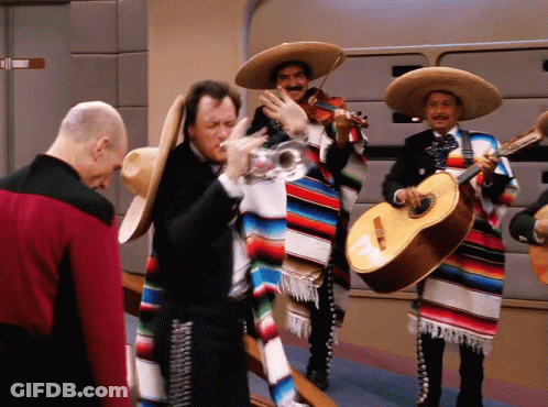 Man In Red Jacket With Mariachi Musicians GIF