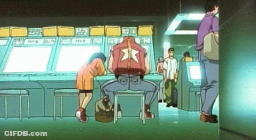 Man In Red Jacket With Star At Arcade Machine GIF