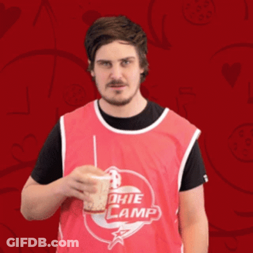 Man In Red Jersey Drinking From Cup Saying Nuda GIF
