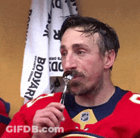 Man In Red Jersey Eating Food GIF
