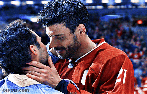Man In Red Jersey Kissing Another Man GIF