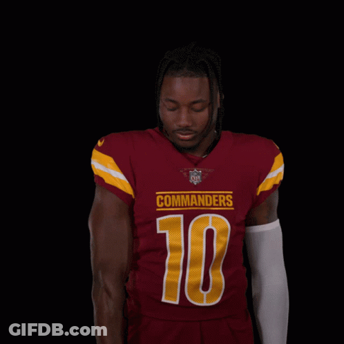 Man In Red Jersey Number 10 Holding Football GIF