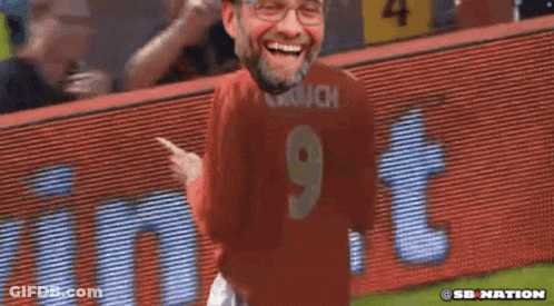 Man In Red Jersey Number 9 Laughing GIF