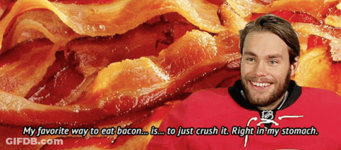 Man In Red Jersey Smiling At Pile Of Bacon GIF