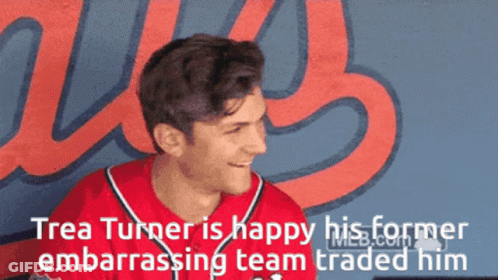 Man In Red Jersey Smiling By Us Wall GIF