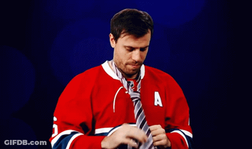 Man In Red Jersey Tying Tie GIF