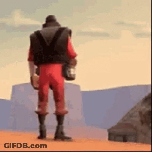 Man In Red Jumpsuit Holding Water In Desert GIF