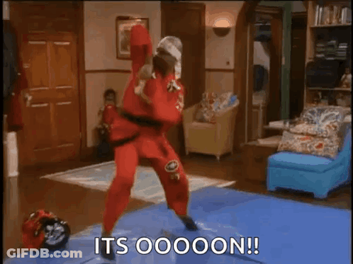 Man In Red Karate Outfit On Blue Mat GIF